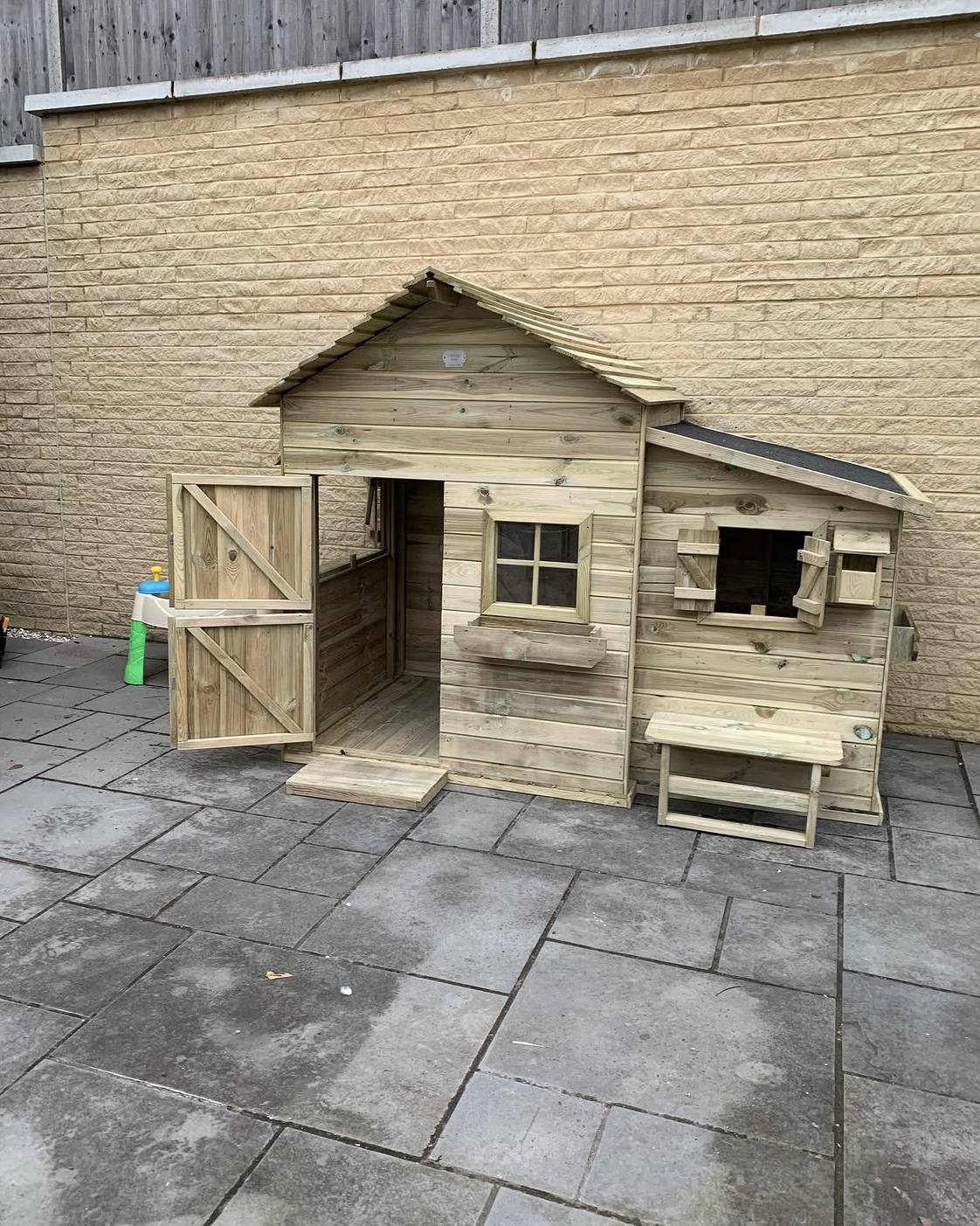 Bespoke-built timber Wendy house with apex roof, stable door and shutters