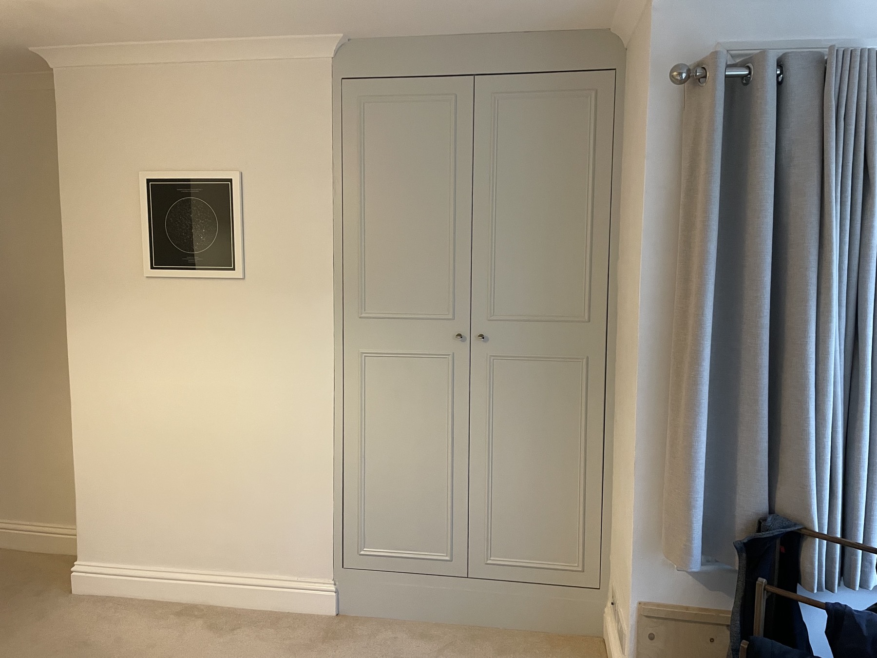 Built-in wardrobe scribed into a recess with Victorian beaded doors