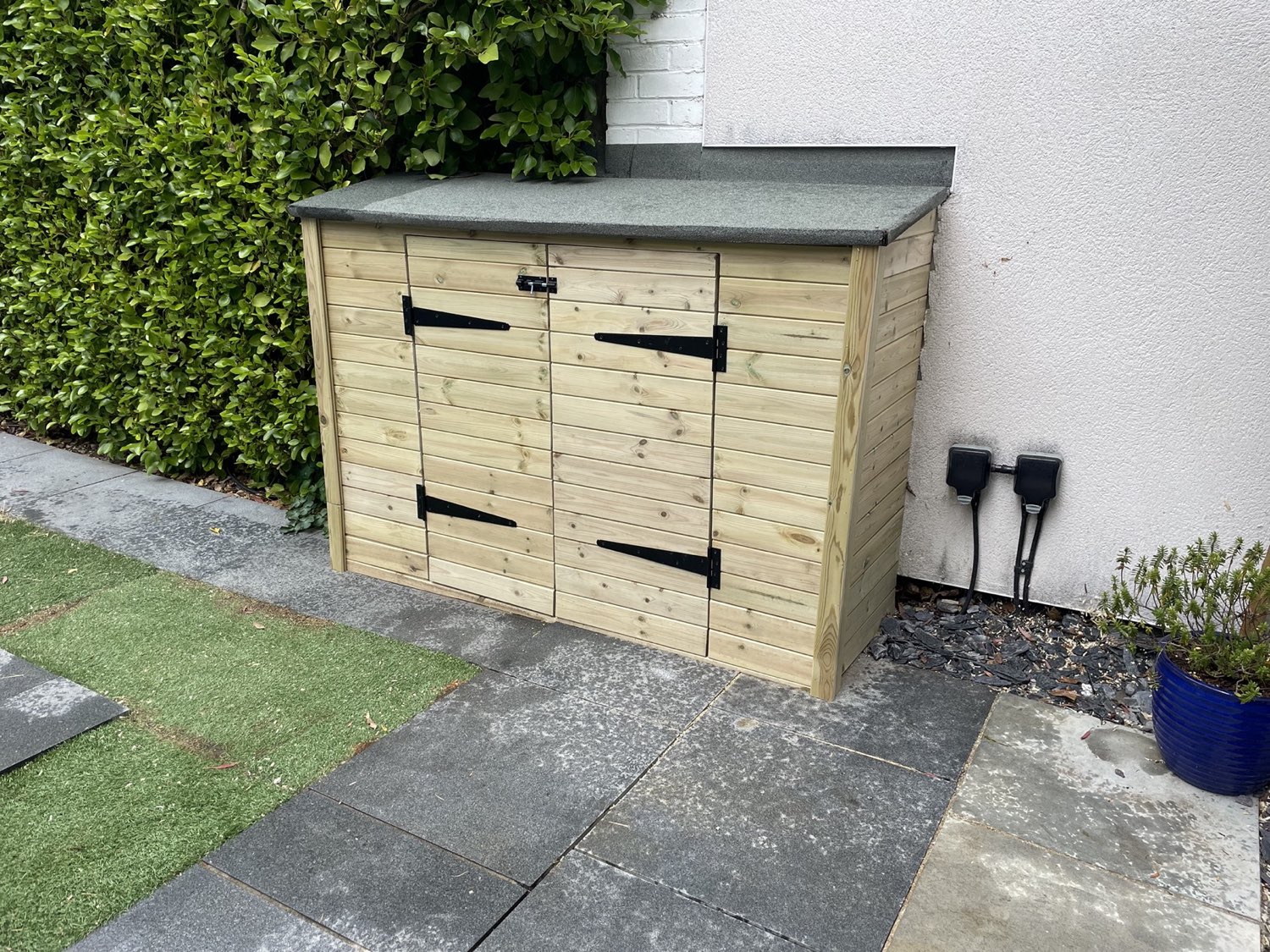 Timber outdoor storage box with felt roof