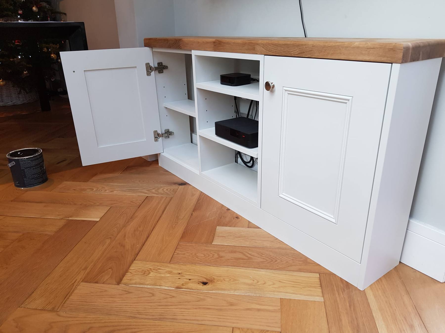 Freestanding TV media unit with oak top and cable-managed compartments