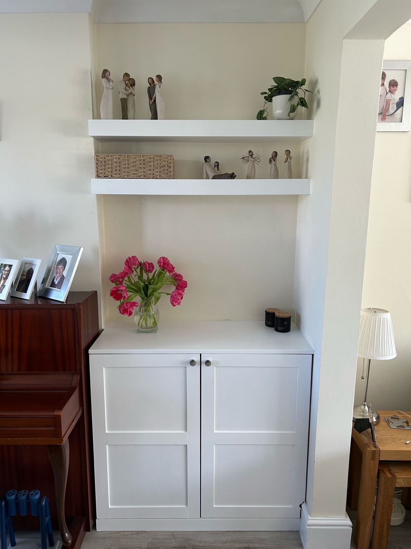 Single alcove cupboard with floating display shelves above